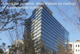 Triangular pyramid steel frames on rooftop of a commercial building