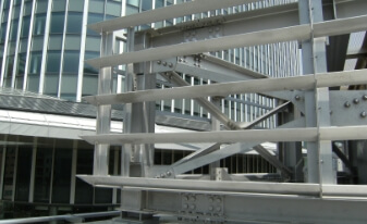 Triangular pyramid steel frames on rooftop of a commercial building